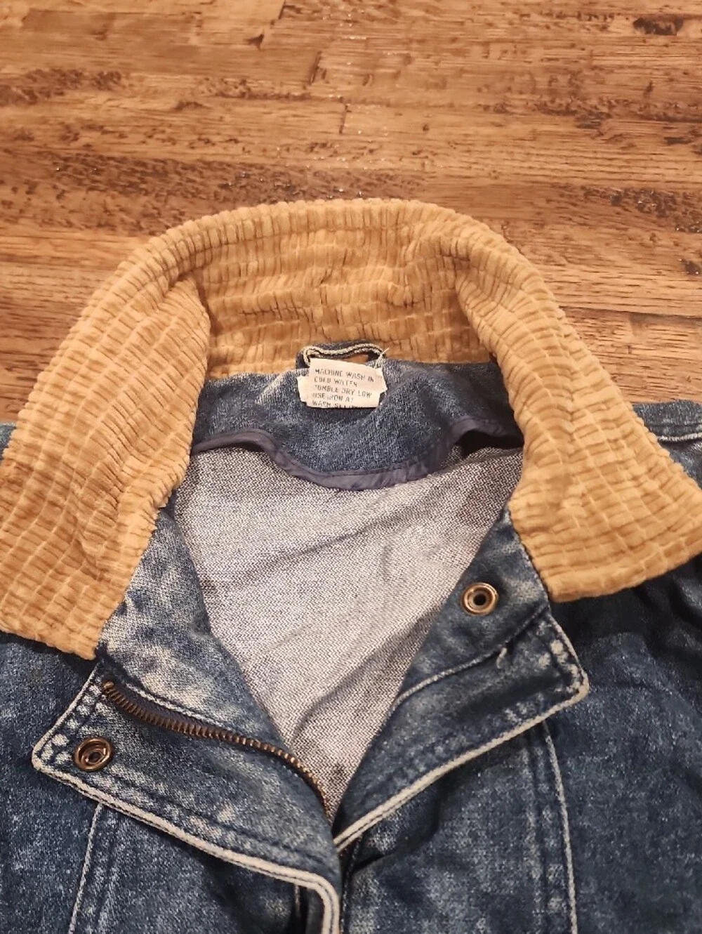 Vtg blue denim bomber jacket featuring a distinctive brown color